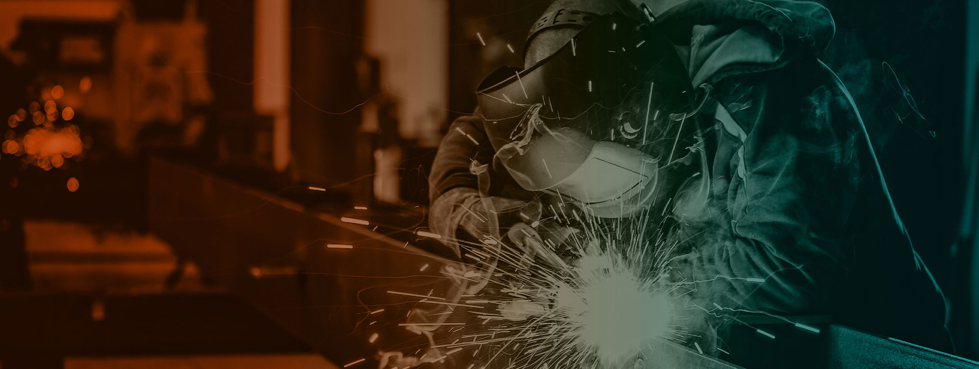 Welder working with tools and creating arc of light